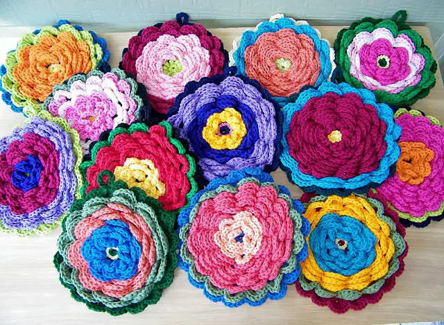 Fanciful Flower Potholders by Claudia Lowman