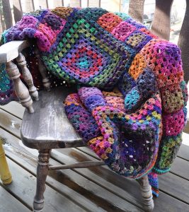 [Free Pattern] The Perfect Granny Square Blanket For Snuggling On The Sofa With Your Little One