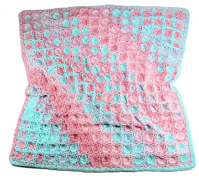 [Free Pattern] Let The Yarn Work Its Magic On Its Own To Create This Spectacular Baby Blanket