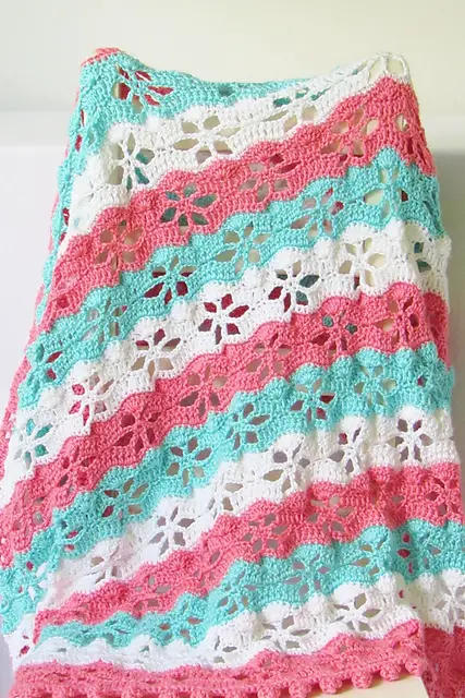 Floral Stitch Blanket With A Pom Pom Border