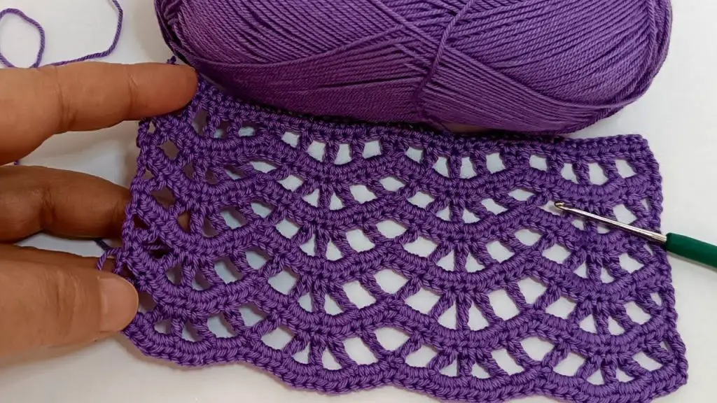 This crochet stitch is truly a wonder for creating stunning summer clothes. With just two rows of lace, this stitch eats up very little yarn, making it perfect for light and airy summer garments.