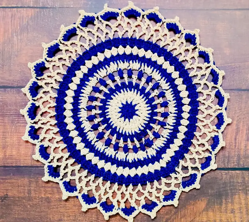 Elevate your home décor with a touch of elegance and charming ambiance, courtesy of the Sapphire Haze Crochet Round Doily.